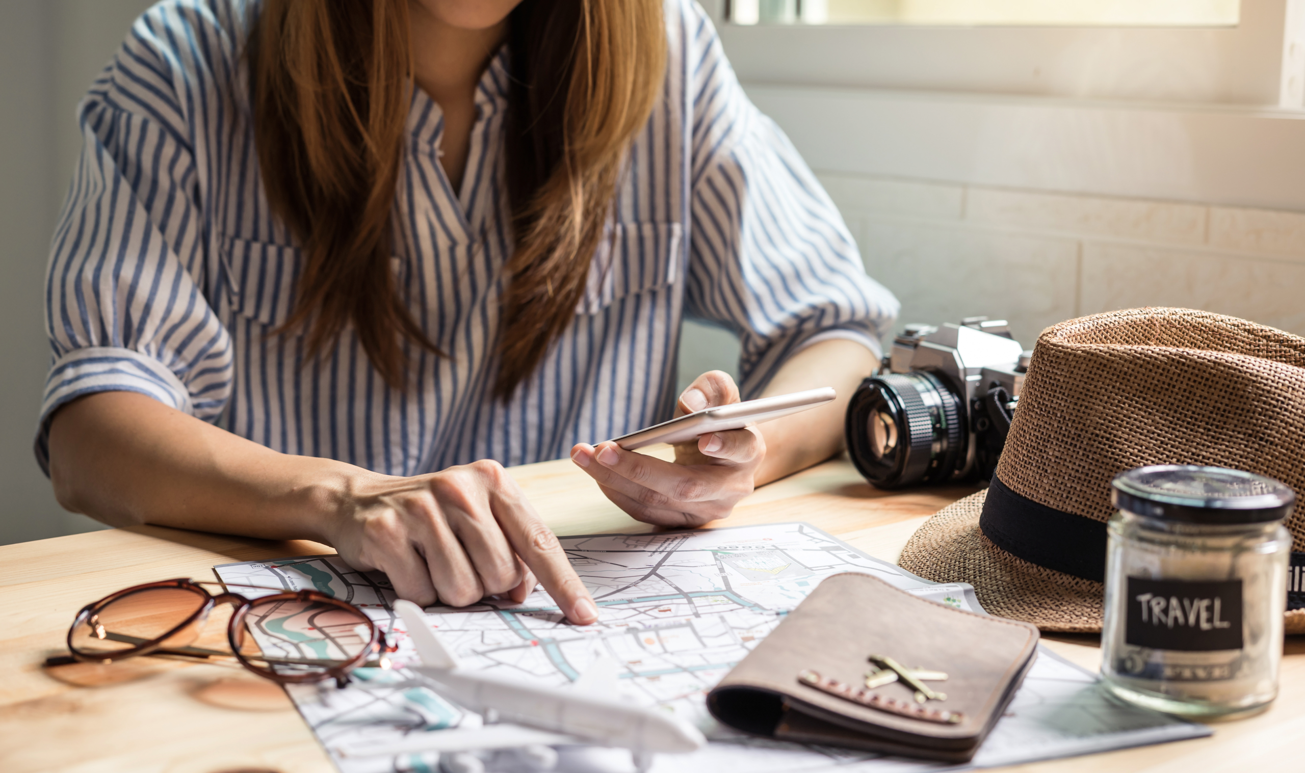 travel planning desk map passport laptop itinerary organization trip preparati