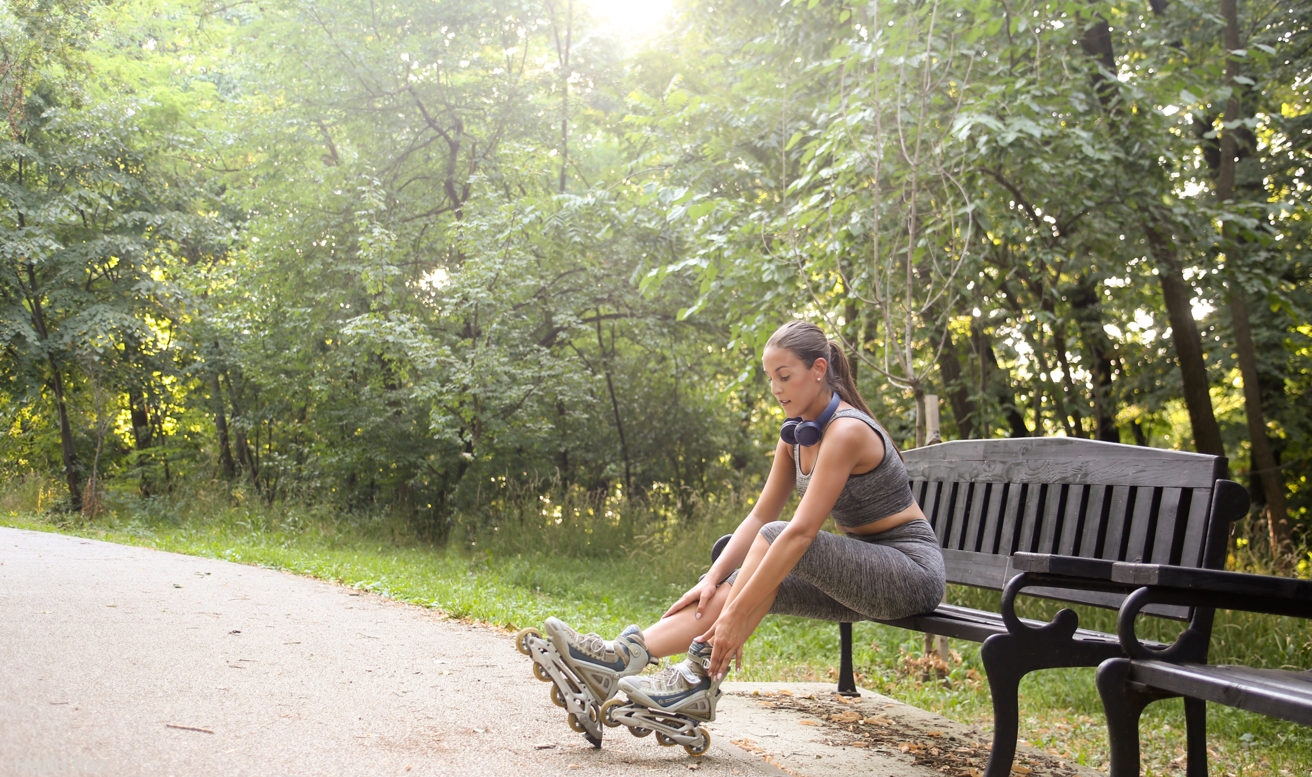 woman skating in a park on a sunny weekend, enjoying outdoor lifestyle and freedom